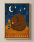 The Sleeping Bear folk art canvas in a natural wood floater frame, seen from the front