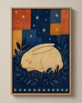 The Sleeping Hare folk art canvas in a natural wood floater frame, seen from the front