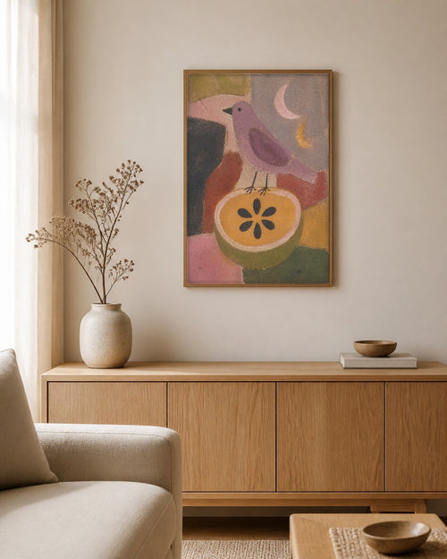 The Bird and the Cut Fruit framed canvas hanging above a sideboard in a calm living room