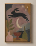 The Hare and the Late Moon muted folk art canvas in a natural wood floater frame, seen from the front